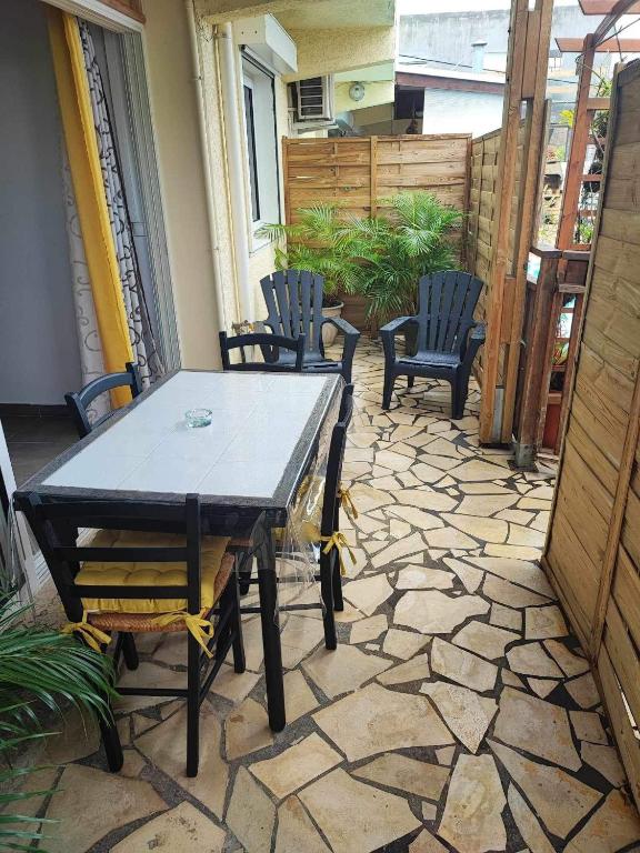 Patio nebo venkovní prostory v ubytování Le Latanier