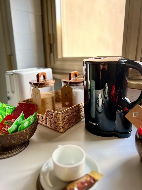 a toaster sitting on a counter next to some baskets at Flaminio Luxury Home - City Center in Rome