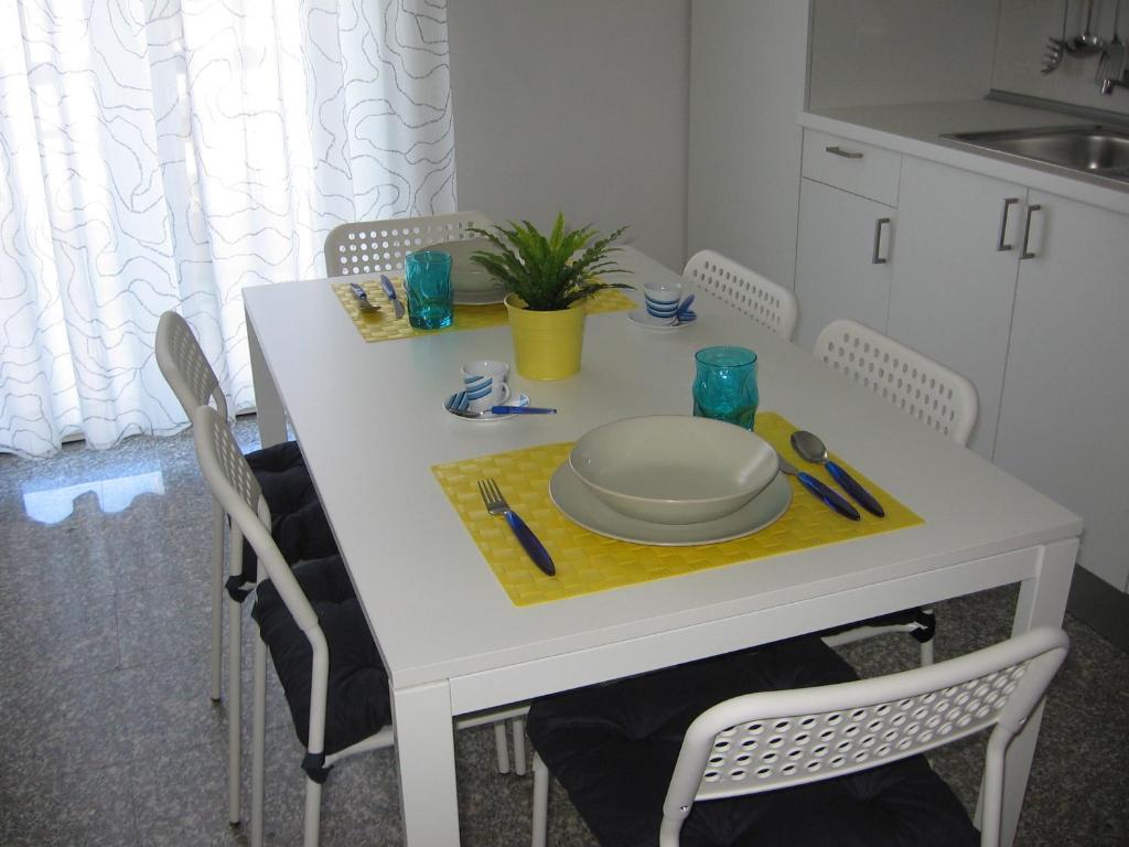 a white table with a plate on it in a kitchen at Antonella's House in Vasto