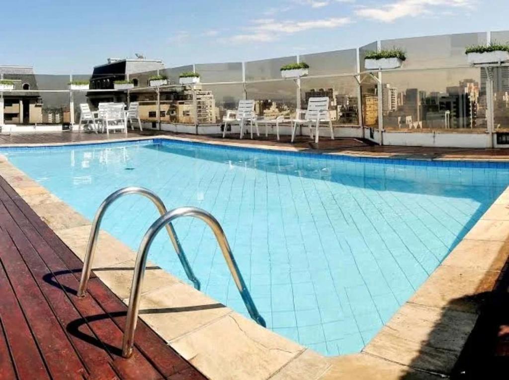 a large swimming pool on top of a building at Flat Triplo - 50 m Av Paulista - By Palm Rooms - 129 in Sao Paulo