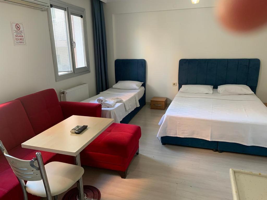 Ein Bett oder Betten in einem Zimmer der Unterkunft AQQA RESİDANCE