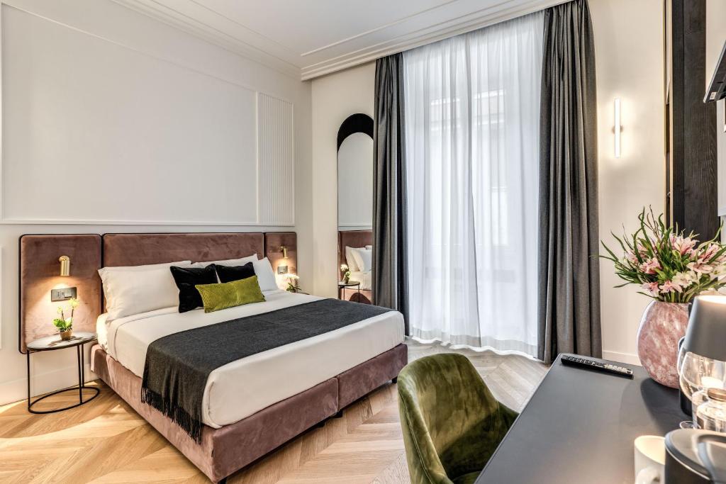 Postel nebo postele na pokoji v ubytování Residenza Piranesi Boutique Hotel