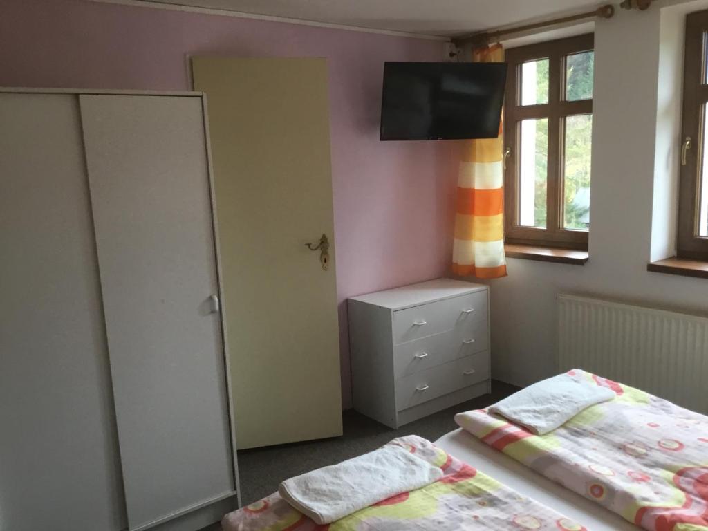Postel nebo postele na pokoji v ubytování Penzion Real