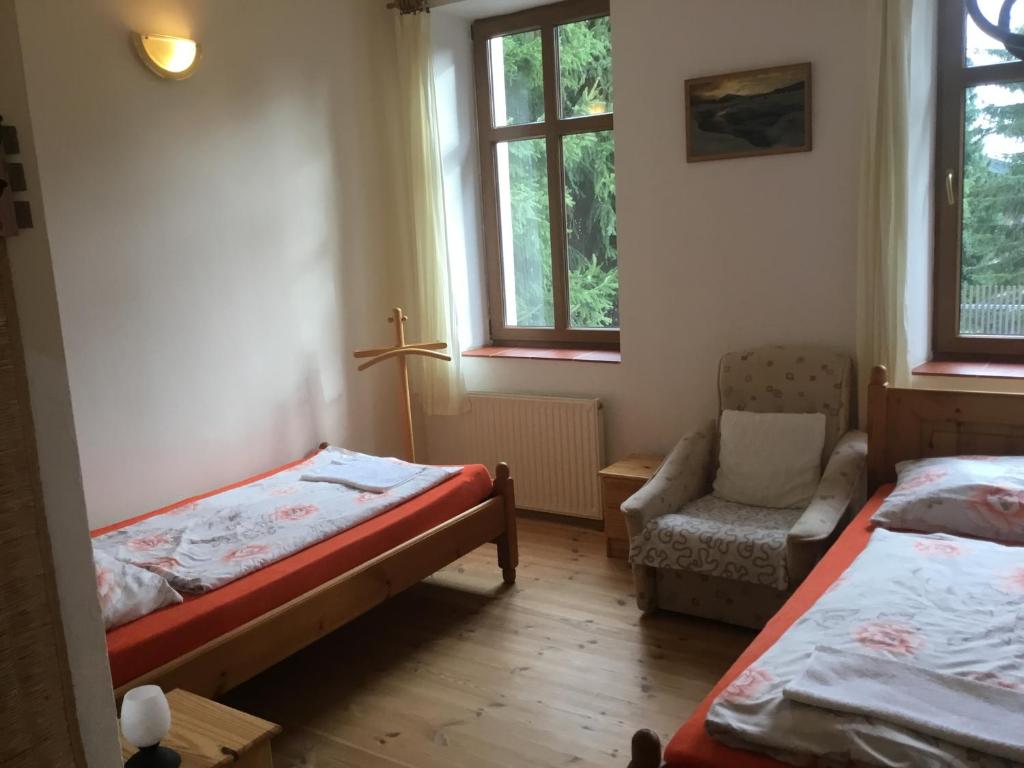 Postel nebo postele na pokoji v ubytování Penzion Real