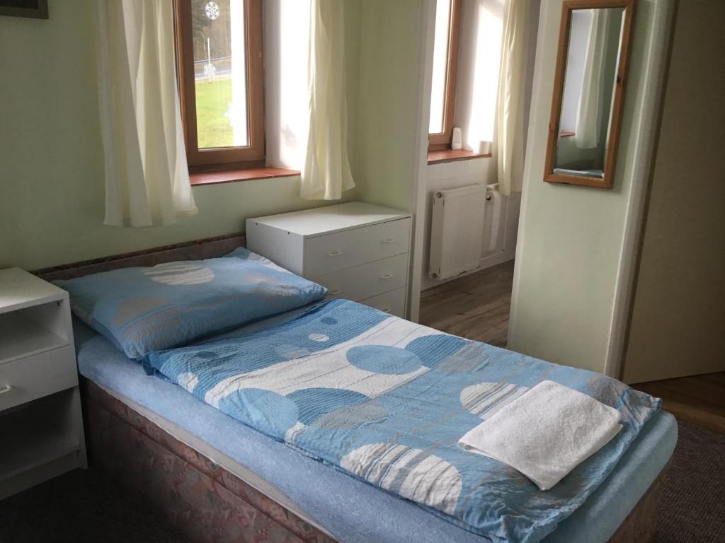 Postel nebo postele na pokoji v ubytování Penzion Real