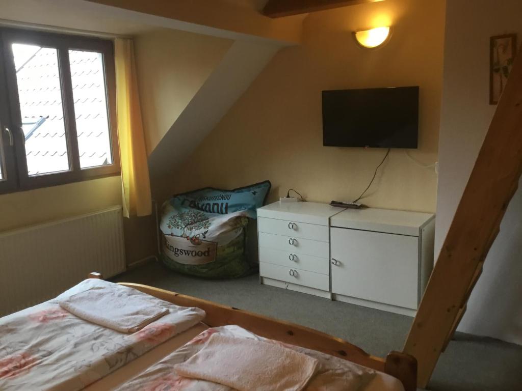 Postel nebo postele na pokoji v ubytování Penzion Real