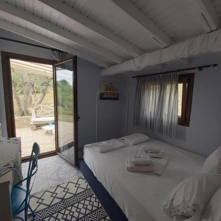 Postel nebo postele na pokoji v ubytování Beach House Onar