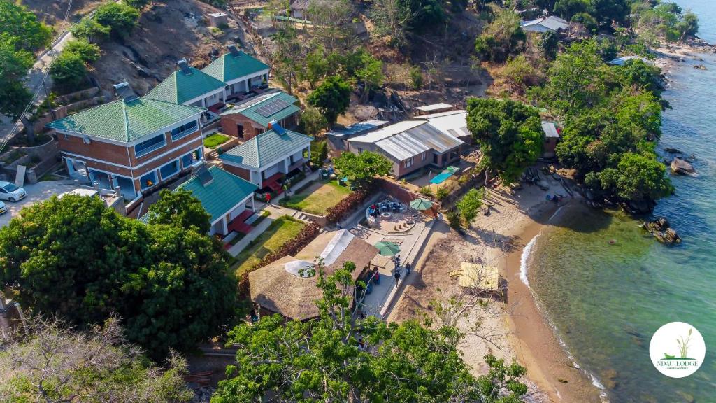 an aerial view of a house on the beach at Ndau Lodge in Nkhata Bay