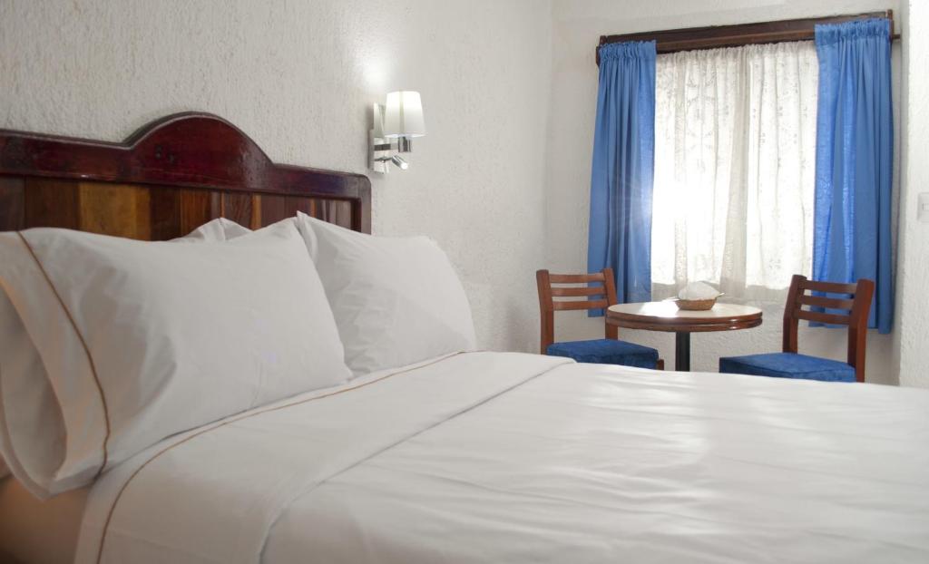 Cama ou camas em um quarto em Eco-hotel El Rey del Caribe