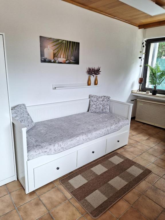 Ένα ή περισσότερα κρεβάτια σε δωμάτιο στο Ferienwohnung W.Esel