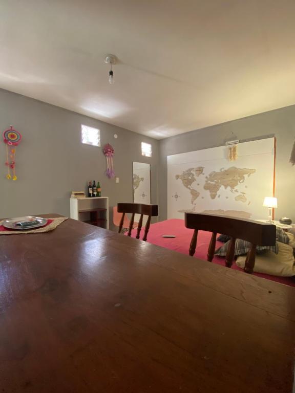 a living room with a table and two chairs at Mielcita in Tinogasta