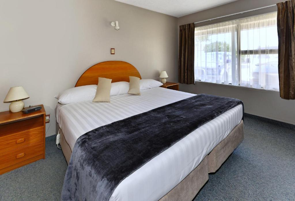 Postel nebo postele na pokoji v ubytování Classique Lodge Motel