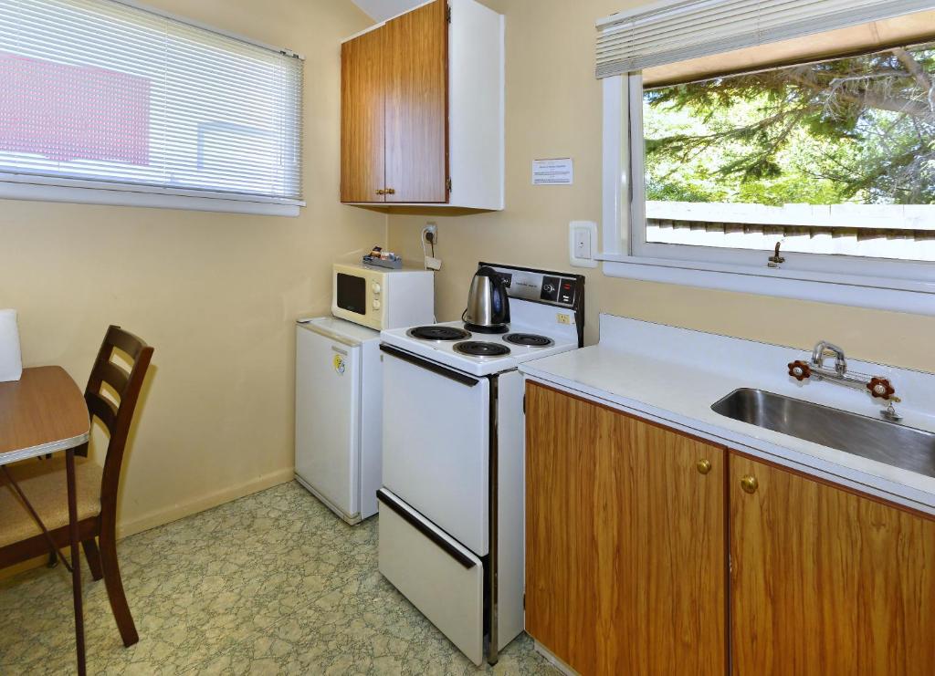 Kuchyň nebo kuchyňský kout v ubytování Classique Lodge Motel