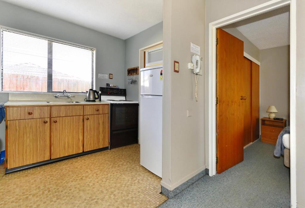 Kuchyň nebo kuchyňský kout v ubytování Classique Lodge Motel