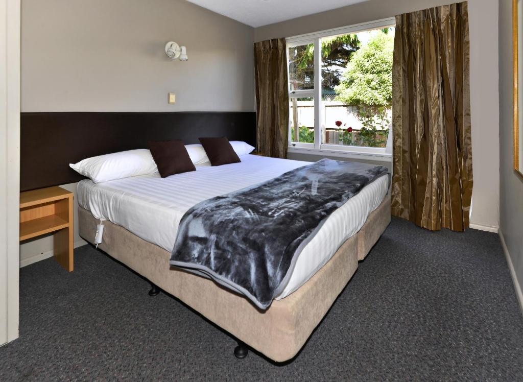 Postel nebo postele na pokoji v ubytování Classique Lodge Motel
