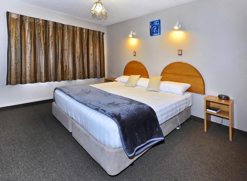 Postel nebo postele na pokoji v ubytování Classique Lodge Motel