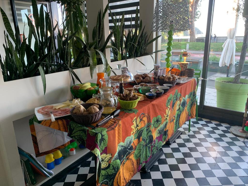 a table with food on it in a room with plants at Seven boutique hotel in Sestri Levante