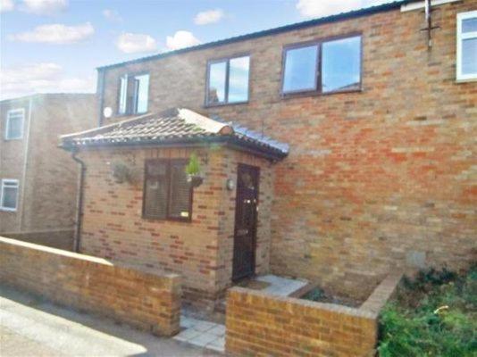 a brick house with a door and a window at Heads on Bed Pitsea Basildon Essex House with Free Parking Netflix & Wifi in Basildon