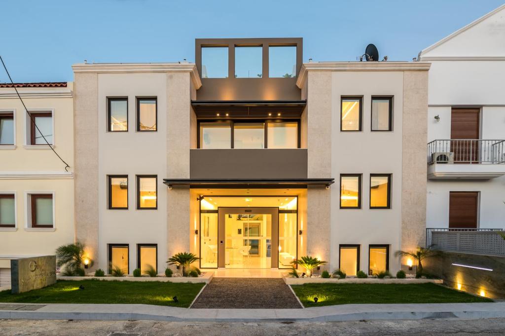 a house with a front door lit up at night at GM exclusive Luxury Suites & SPA in Sitia