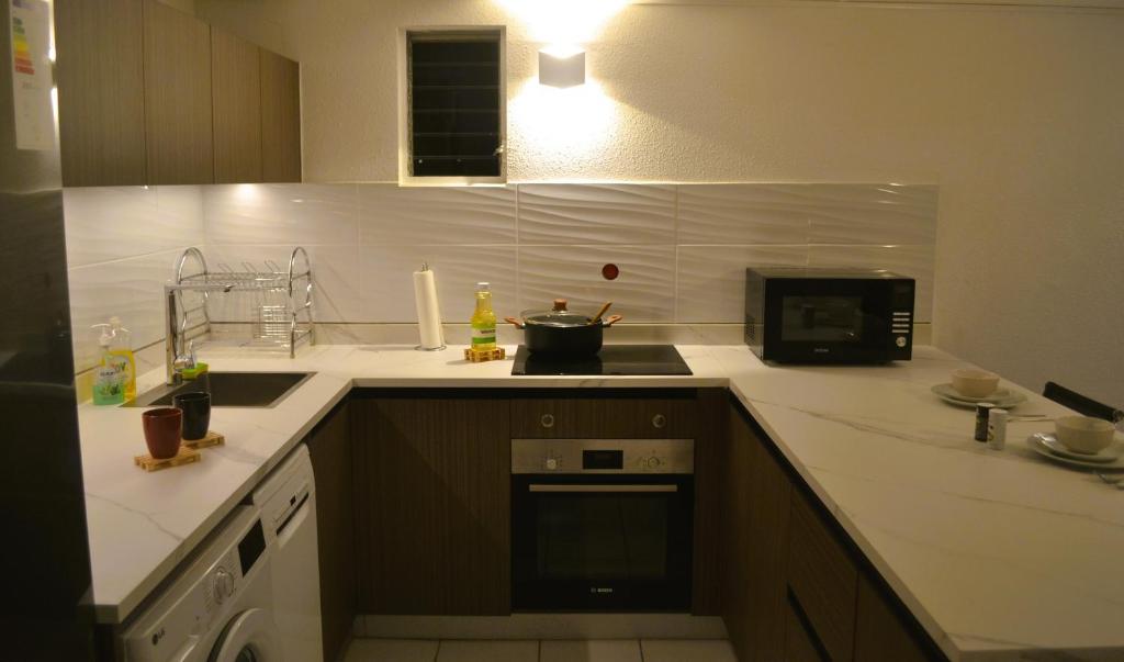 Kuchyň nebo kuchyňský kout v ubytování AD Apartment