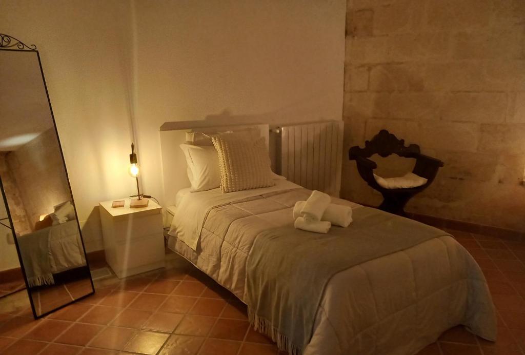 Postel nebo postele na pokoji v ubytování Dimora 1919 Luxury Loft