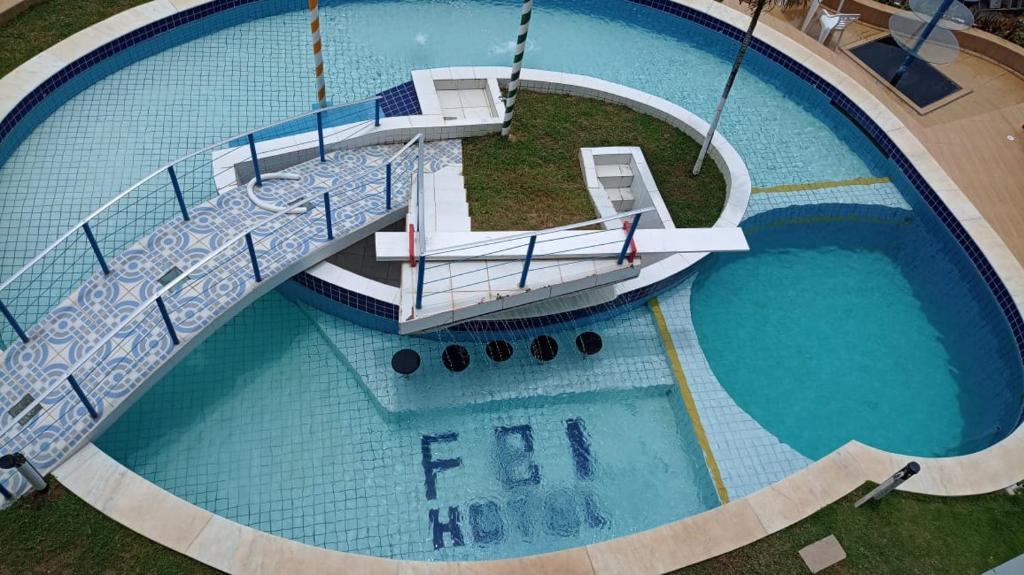 an overhead view of a large swimming pool at Flat Beach Itamaracá - pousada FBI in Itamaracá