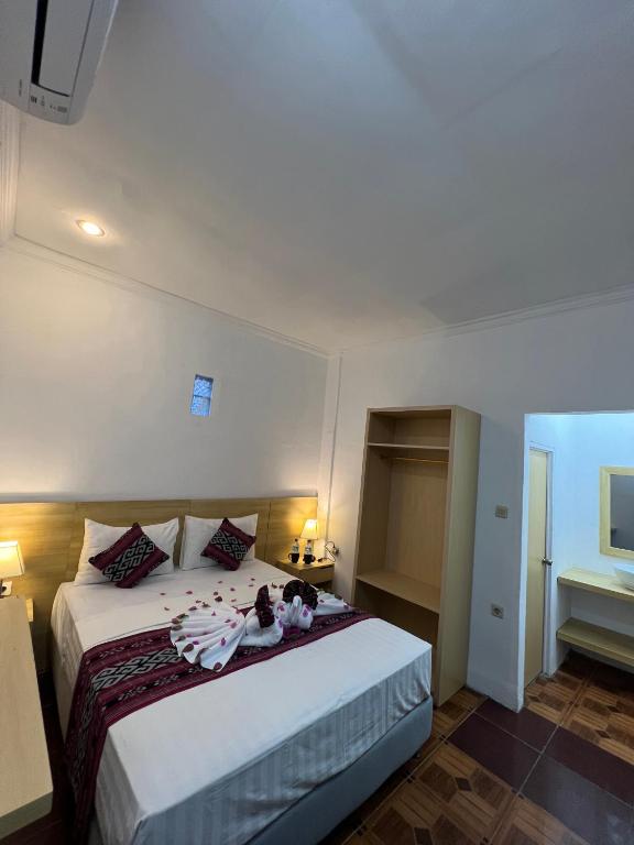 Postel nebo postele na pokoji v ubytování Seaside Hotel