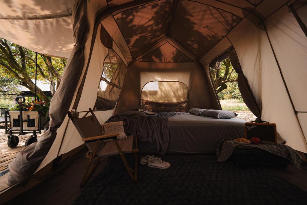 Кровать или кровати в номере Suối Camp