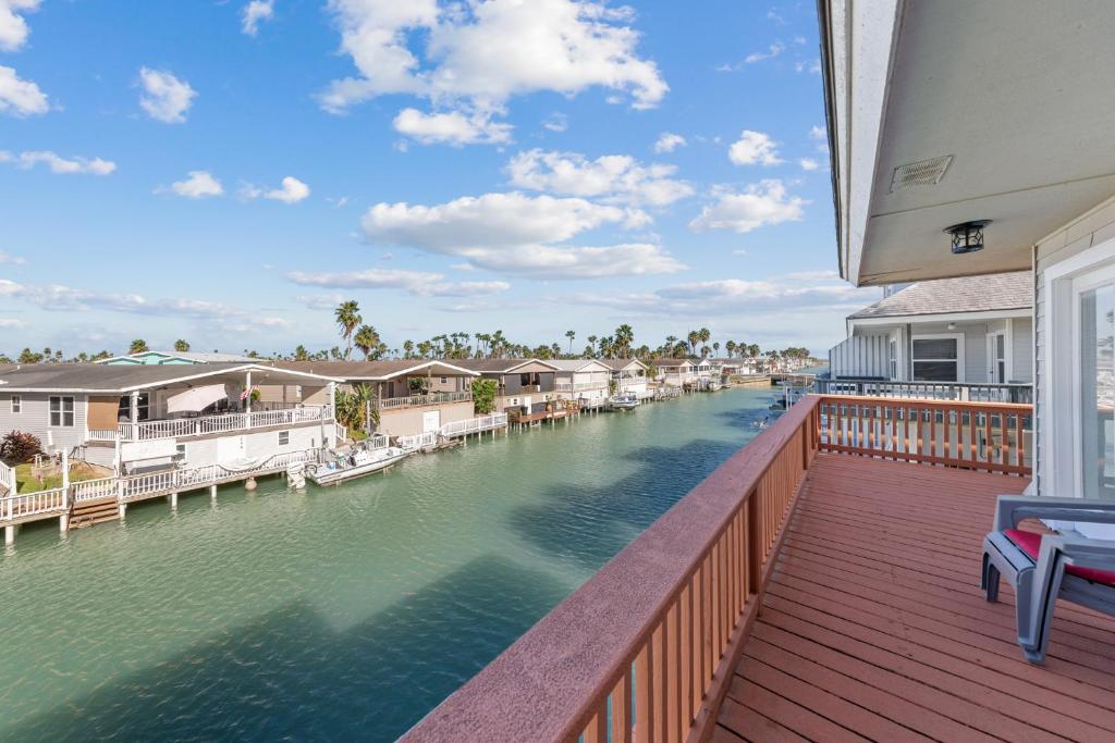 a view of a river from a balcony of a house at Sea Cottage Retreat 1009 in Port Isabel