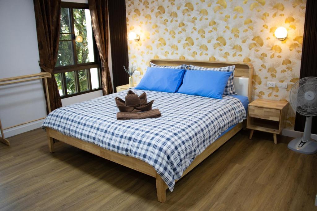 Postel nebo postele na pokoji v ubytování Thai Life Guesthouse Khaolak