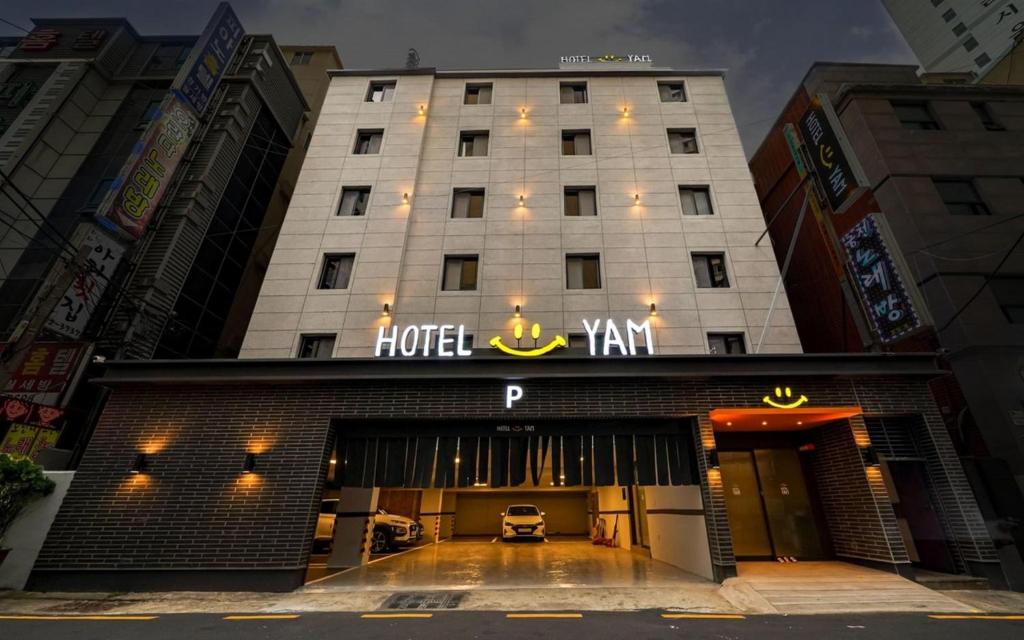 a hotel sign on the front of a building at Hotel Yam Yeonsan in Busan