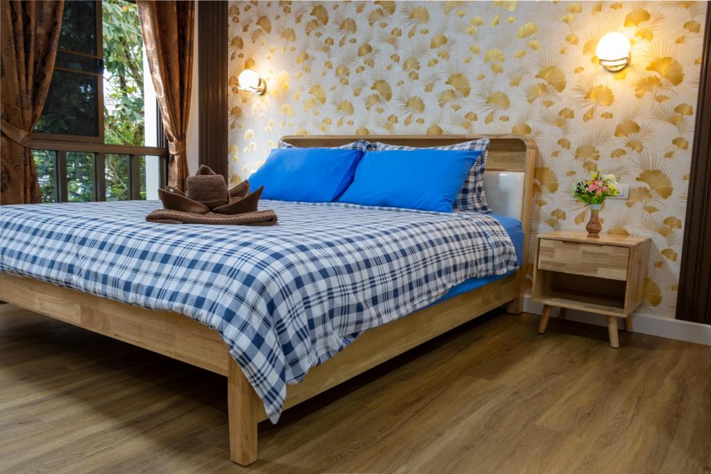 Postel nebo postele na pokoji v ubytování Thai Life Guesthouse Khaolak