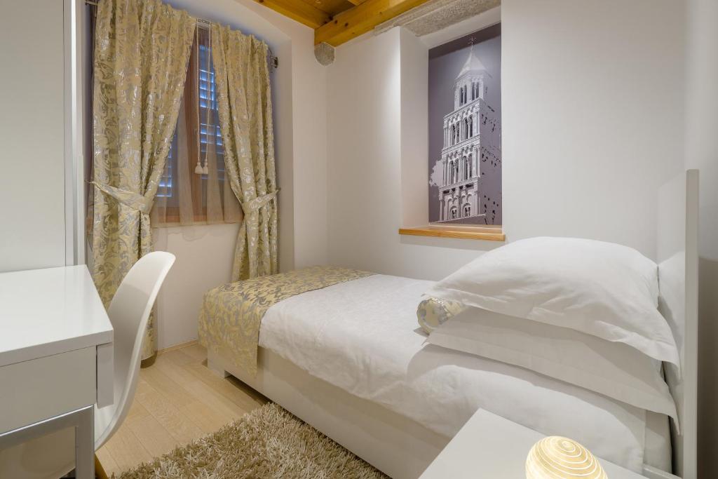 Una cama o camas en una habitación de Villa Valeria