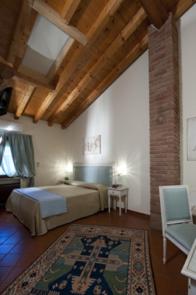 Postel nebo postele na pokoji v ubytování Resort La Mola