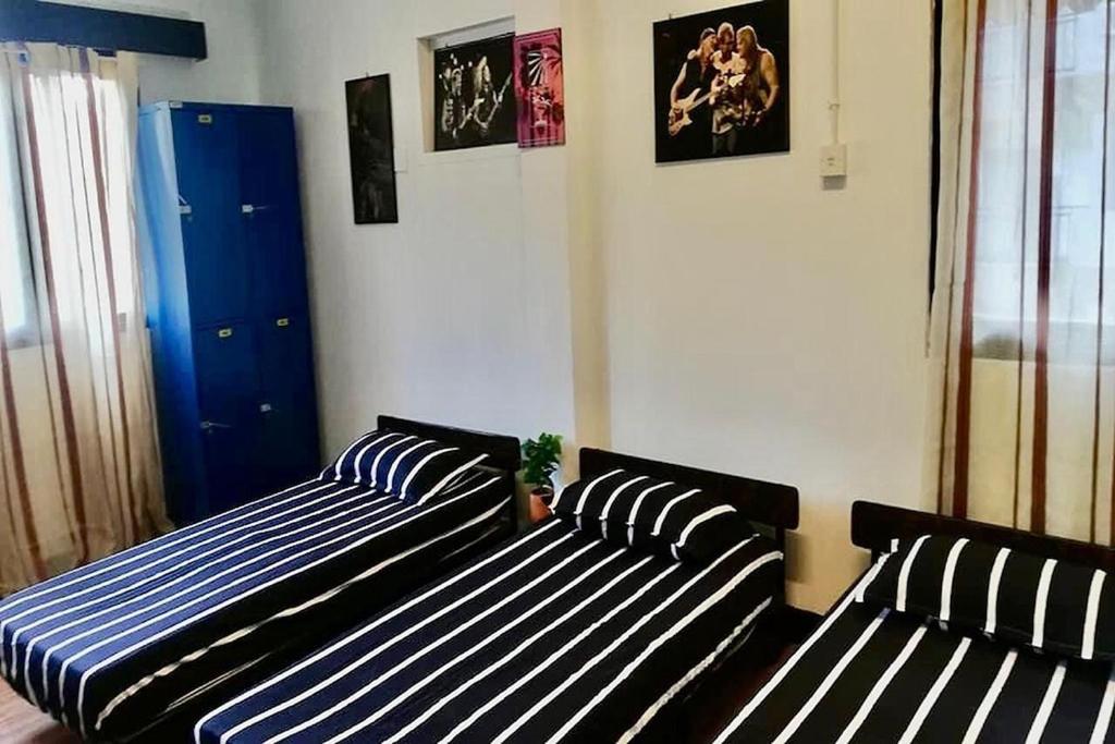 Postel nebo postele na pokoji v ubytování Bagan Pinang Guest House
