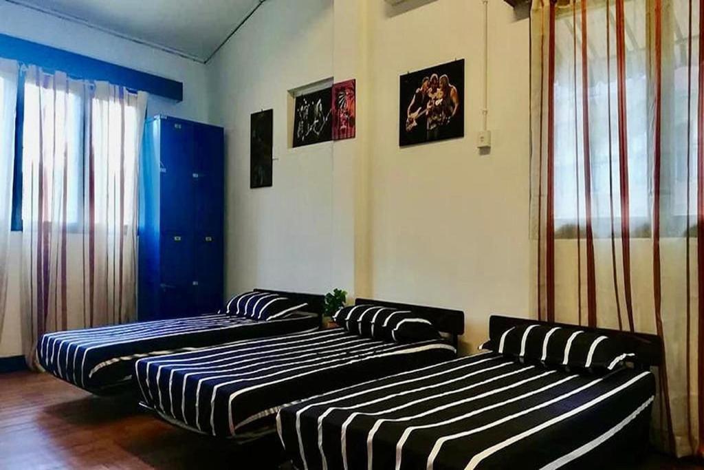 Postel nebo postele na pokoji v ubytování Bagan Pinang Guest House