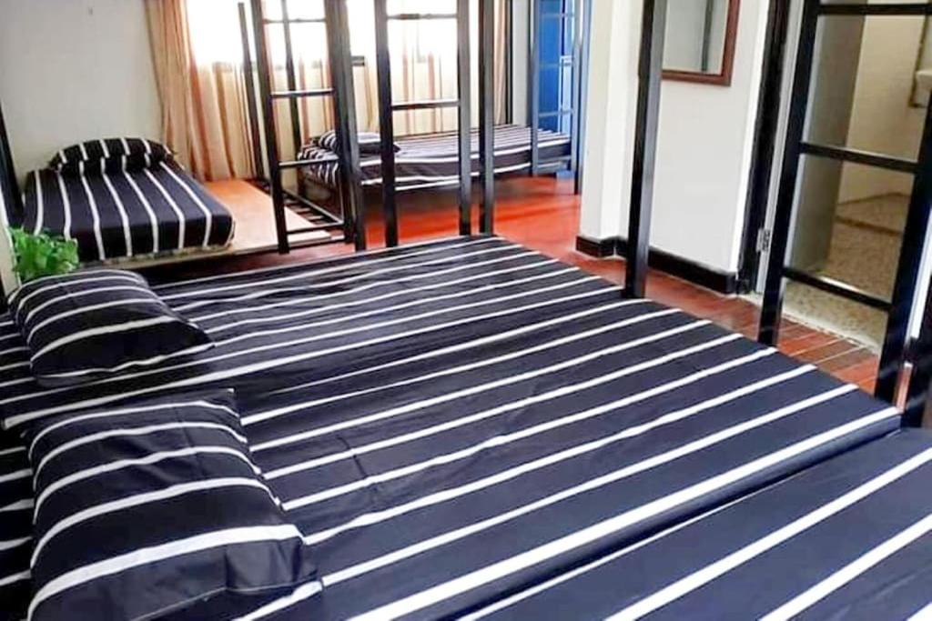 Postel nebo postele na pokoji v ubytování Bagan Pinang Guest House