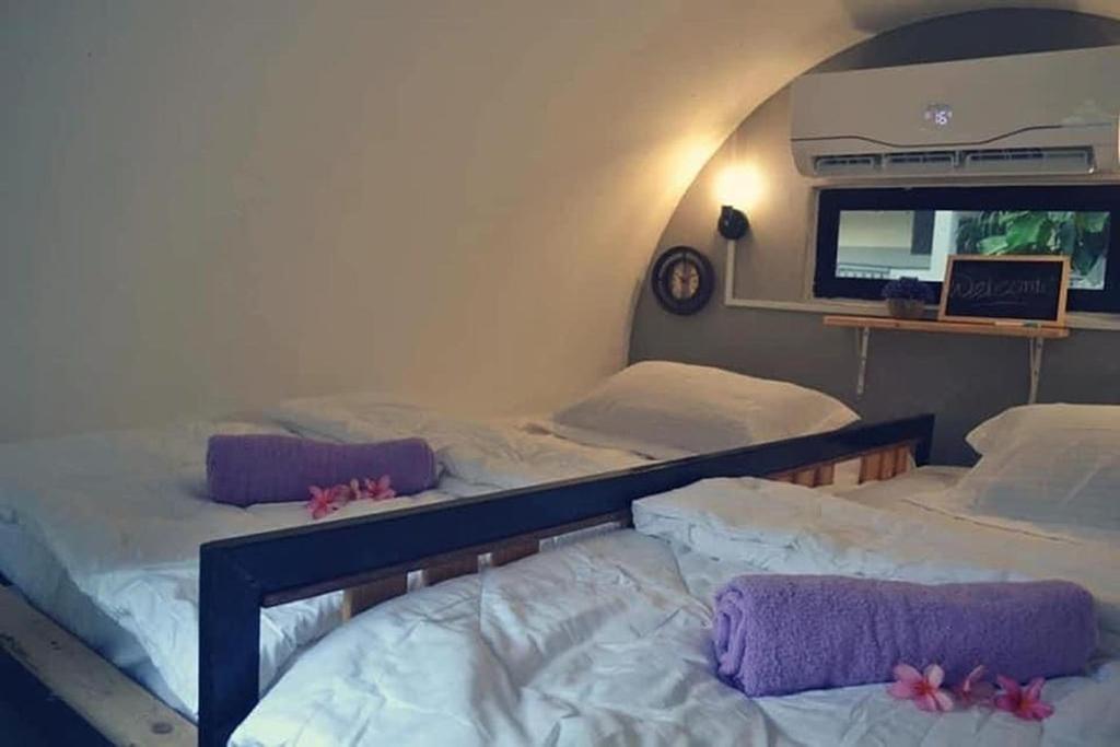 Postel nebo postele na pokoji v ubytování Bagan Pinang Guest House