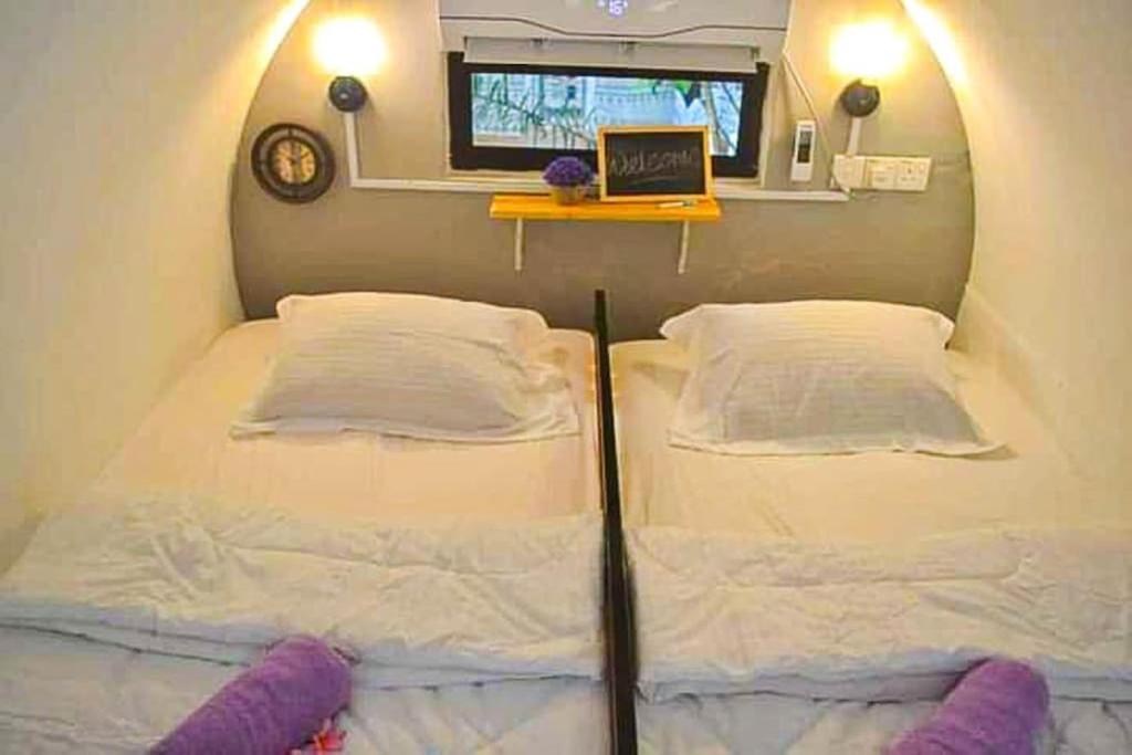 Postel nebo postele na pokoji v ubytování Bagan Pinang Guest House