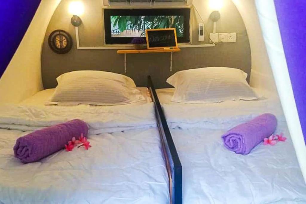 Postel nebo postele na pokoji v ubytování Bagan Pinang Guest House