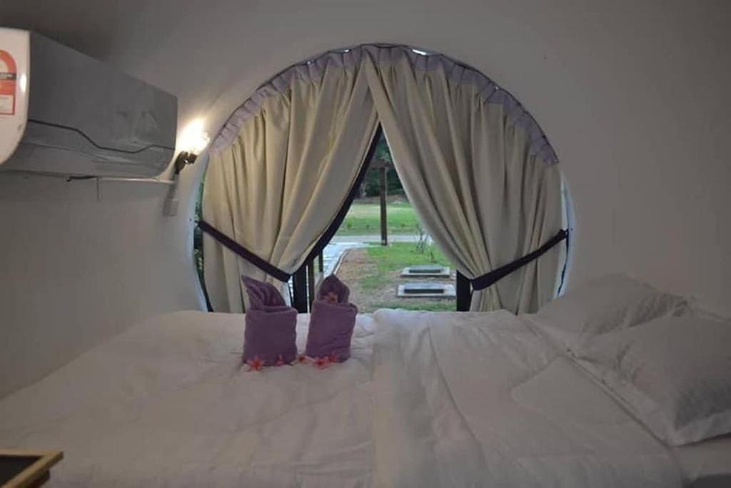 Postel nebo postele na pokoji v ubytování Bagan Pinang Guest House