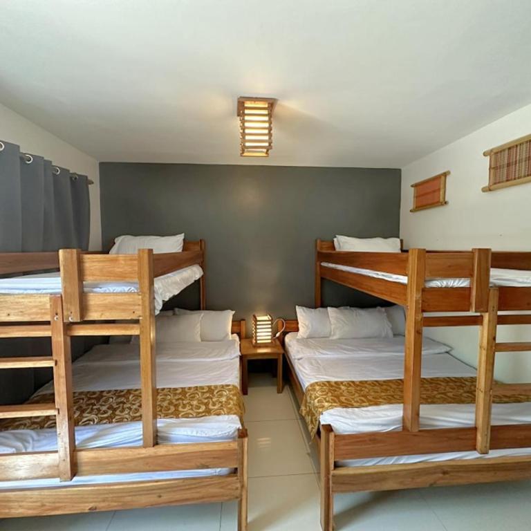 Postel nebo postele na pokoji v ubytování Earl De Princesa Hotel