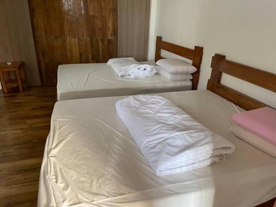 Postel nebo postele na pokoji v ubytování Bagasbas House