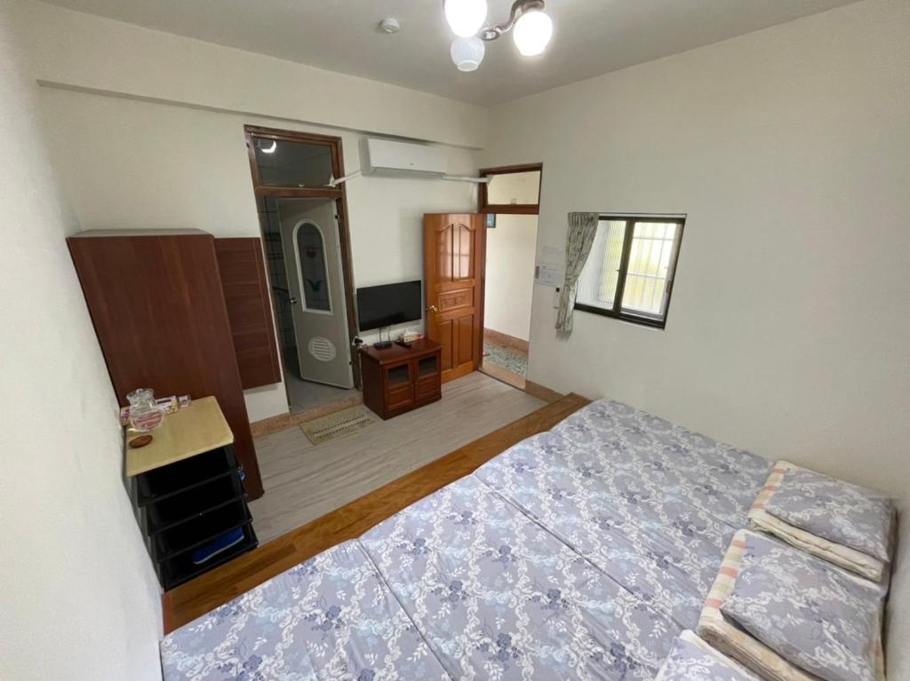 Postel nebo postele na pokoji v ubytování Ya Yuan Homestay