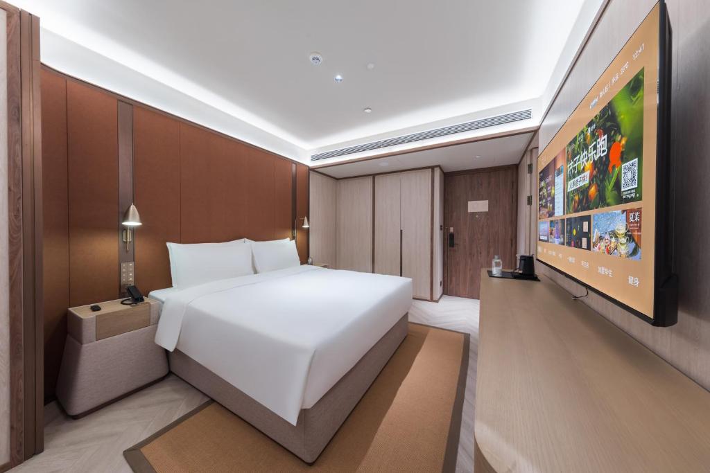 TV a/nebo společenská místnost v ubytování Crystal Orange Hotel - Shenzhen Nanshan Xinhaofang Branch