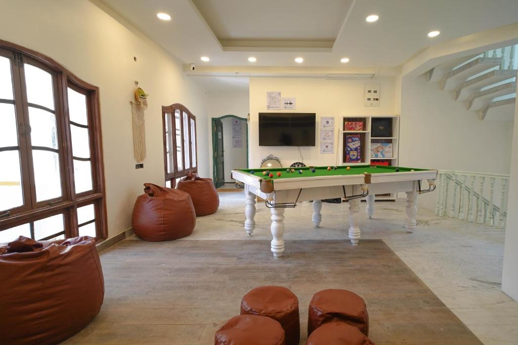 a room with a pool table and a tv at Destin Olympus Banjara in Hyderabad