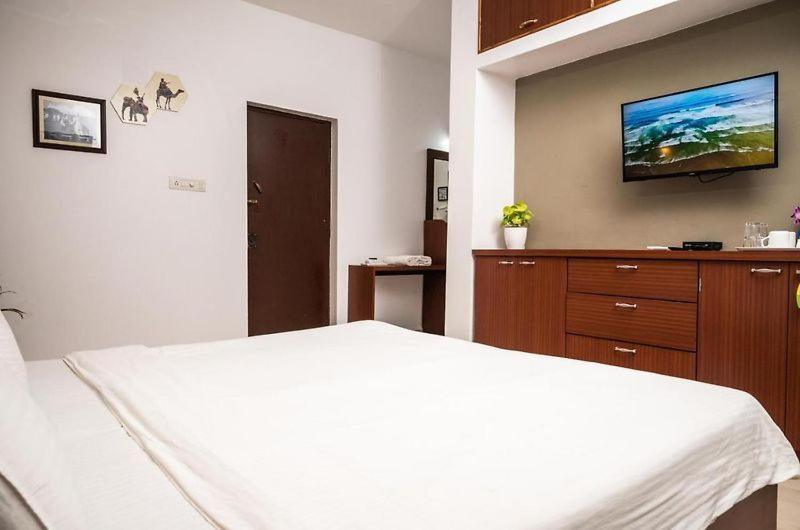 Postel nebo postele na pokoji v ubytování Vintage Beach Resort