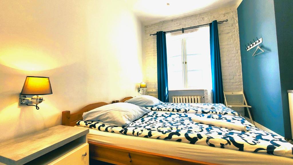 Postel nebo postele na pokoji v ubytování Chmielna 5 Rooms & Apartments