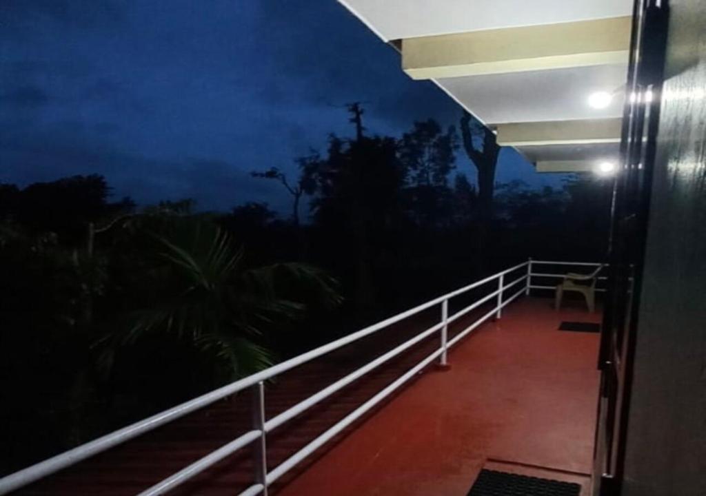 a night view of a balcony of a house at Aiswarya - The Jungle Home in Wayanad