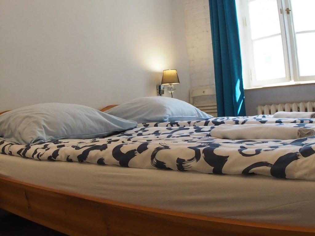 Postel nebo postele na pokoji v ubytování Chmielna 5 Rooms & Apartments
